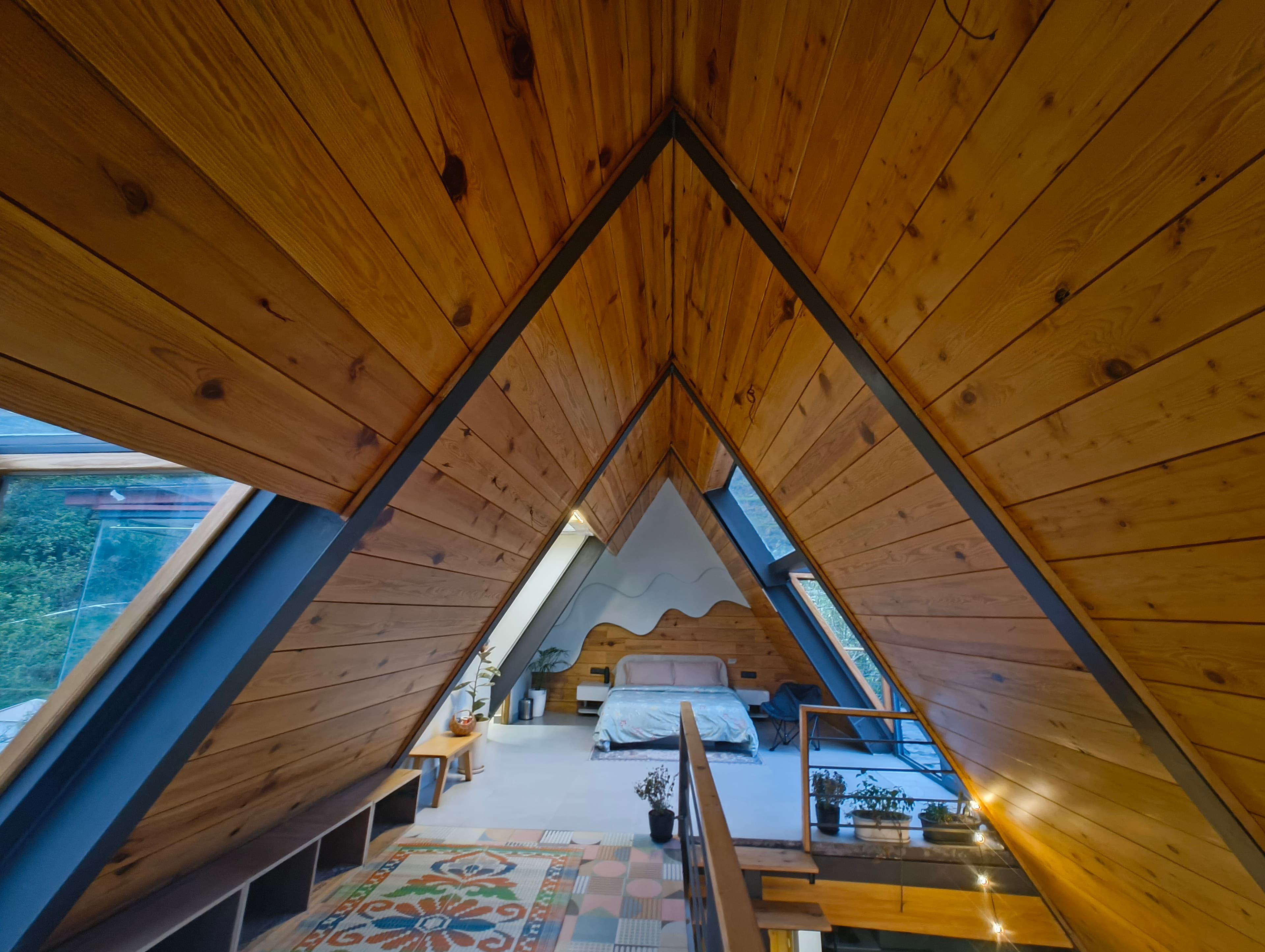 Sky View room — loft with panoramic glass walls